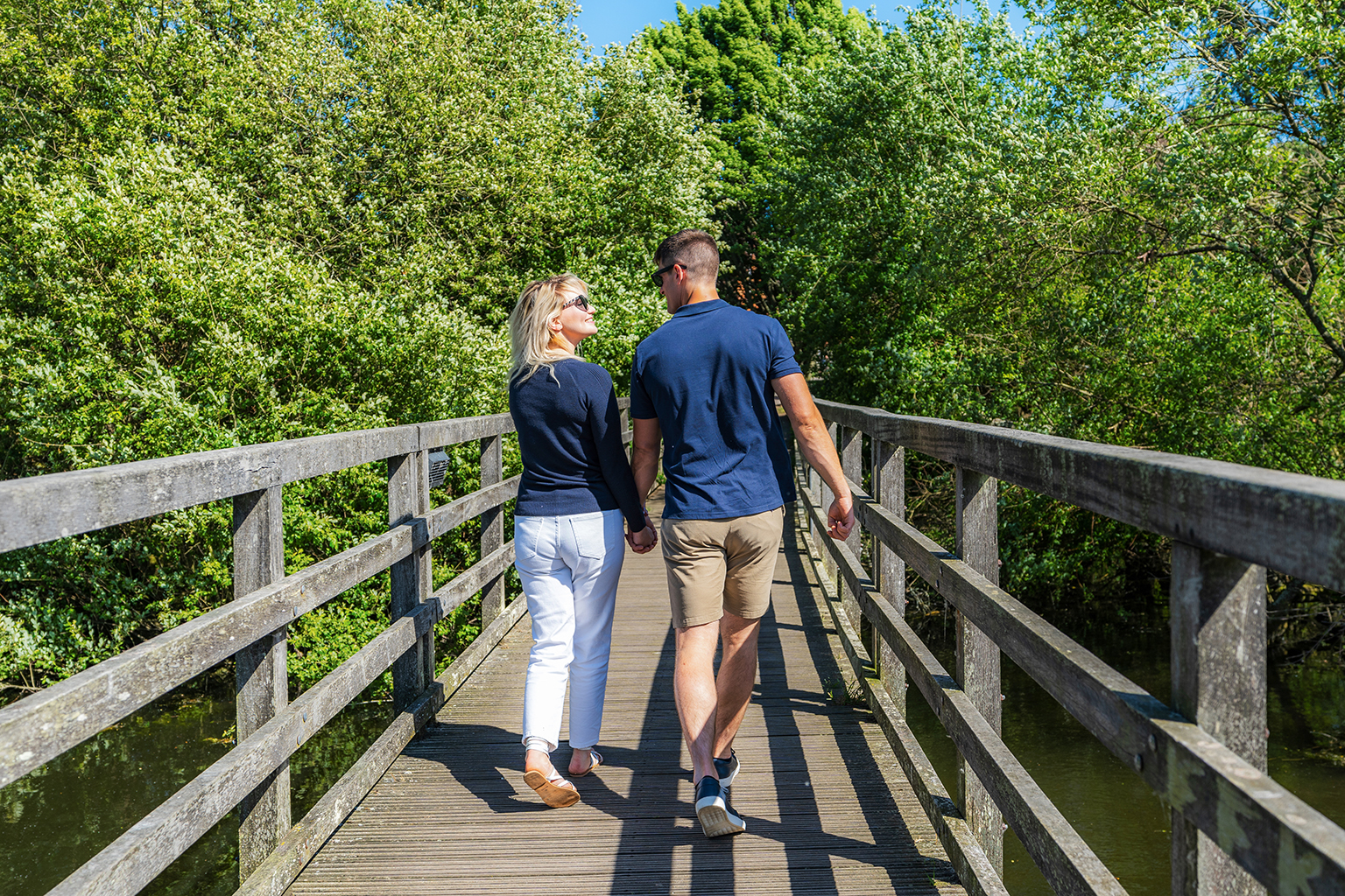 Couple walking on bridge