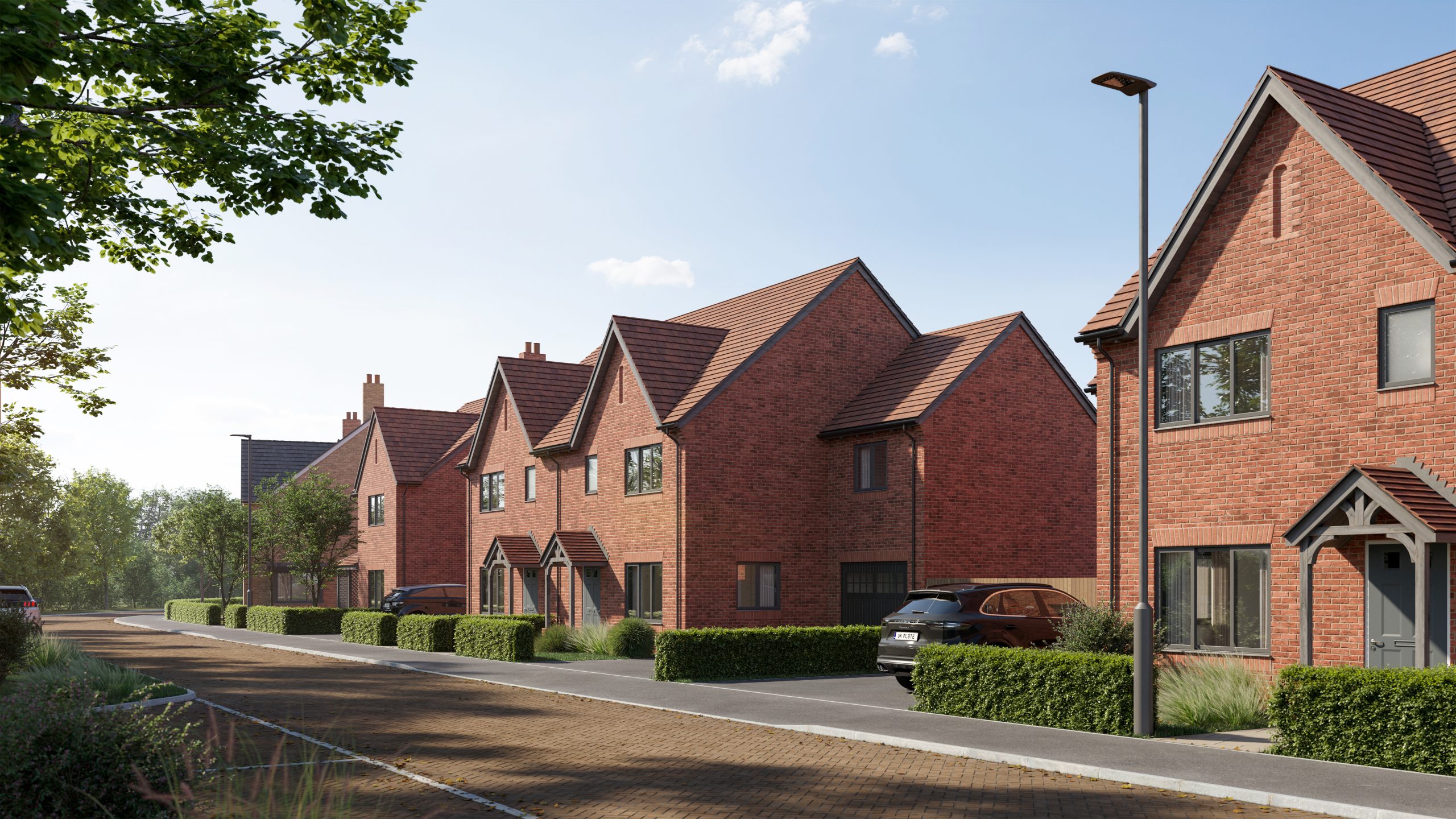 Heritage-style street view at a Bargate Homes development with traditional brick homes