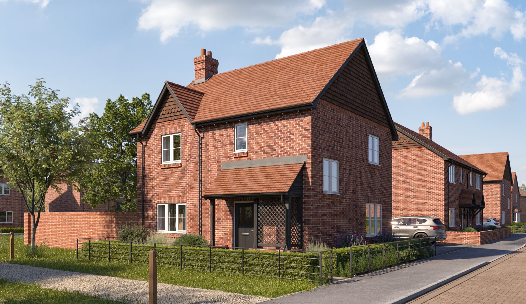 Red brick free standing house - 2/3 bedroom, silver car outside.